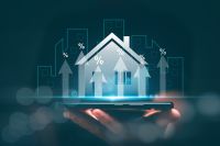 Foto: Hologramm eines Hauses auf einer Hand